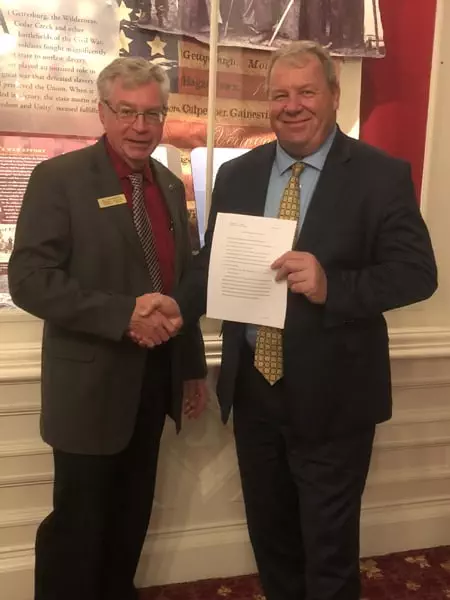 Submitted Jim Harrison (left) and Dave Soucy (right) shake hands.  