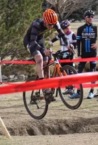 Andrew BORDERN jumping a bicycle over a ditch